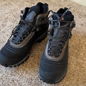 Men’s Merrell black and gray leather hiking boots.